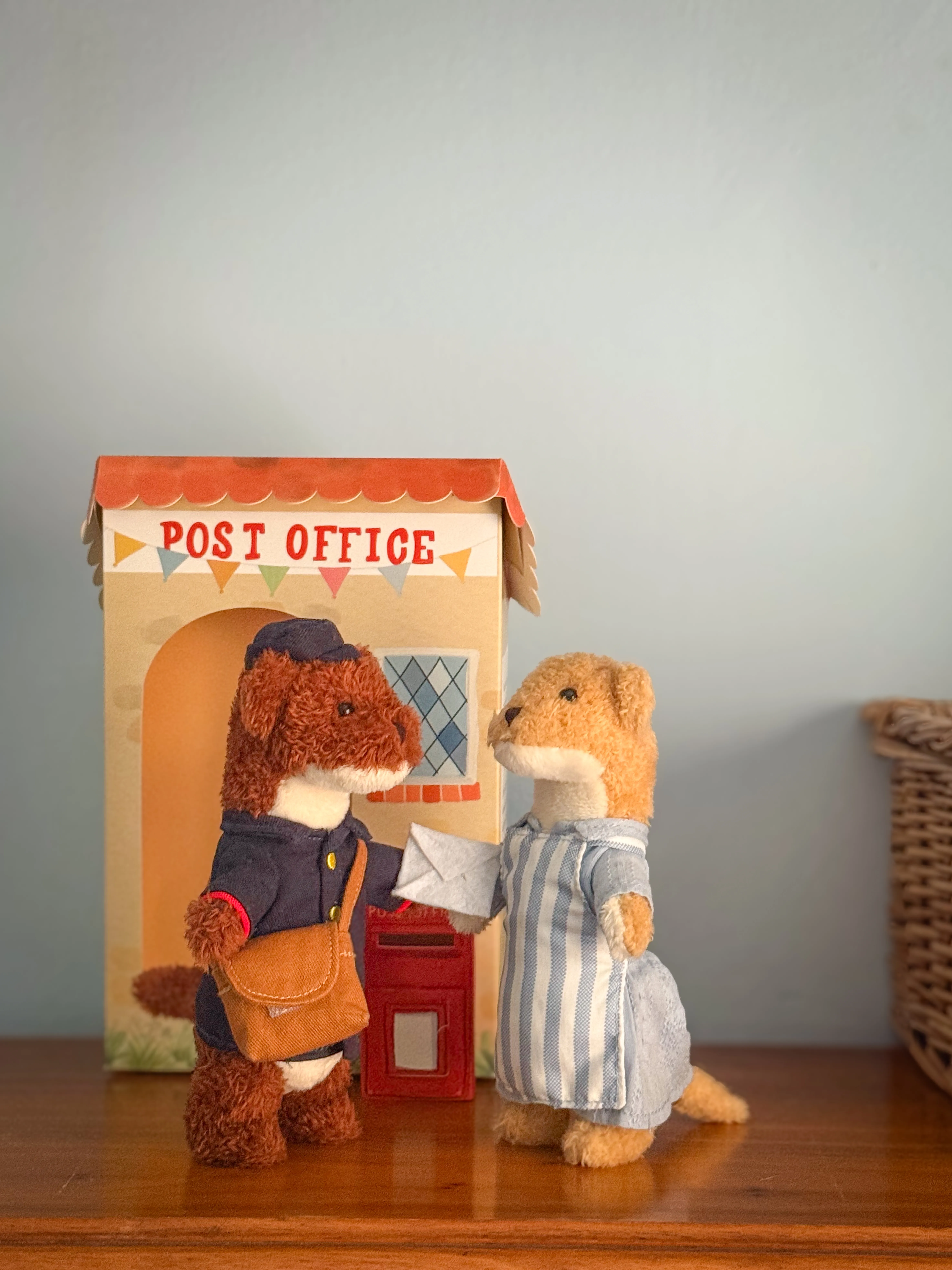 Albert the Postman delivering a letter to Eleanor on a nursery shelf